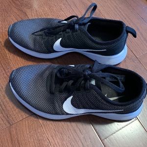 Black Nike Revolution running shoes